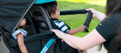 The Compass Quad Four Seater Stroller Comes Equipped with a Removable, Padded Arm Bar for Convenient Loading and Unloading