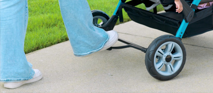 The Compass Quad Four Child Stroller is Equipped with a Foot Operated Braking System